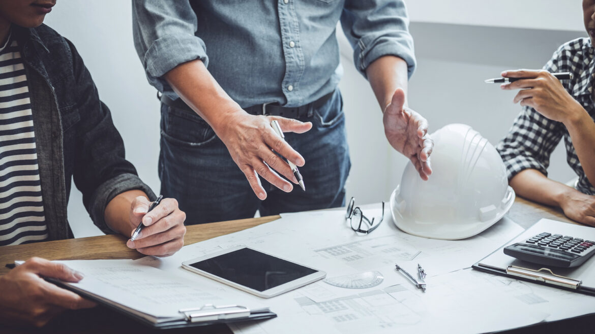 Construction,And,Structure,Concept,Of,Engineer,Or,Architect,Meeting,For Construction and structure concept of Engineer or architect meeting for project working with partner and engineering tools on model building and blueprint in working site, contract for both companies.