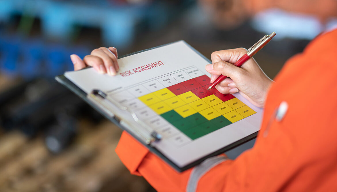 Risk management -ballpoint pen marking on the risk assessment matrix table